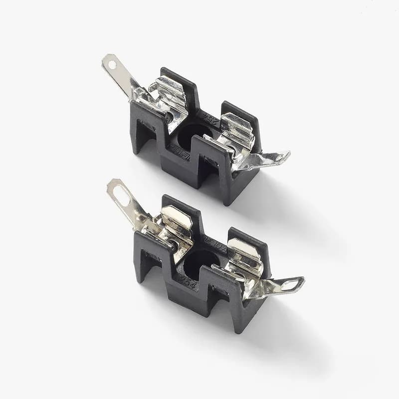 2AG OMNI-BLOCK HOLDER BOARD MOUNT 1 POLE. This low profile Omni-Blok® Fuse Block design is available with a choice of solder type terminals, Q.C. terminals or P.C. board mountable terminals. The PCB design is offered with either tin-plated brass terminals for normal applications or tin-plated beryllium copper terminals for use in caustic environments. These fuse blocks feature individual barriers which reinforce the fuse clips while providing greater protection against clip damage and electrical shock. The unique design permits self-alignment of clips to fuse cap. This, plus a one-piece clip/terminal assures low contact resistance. Multiple units may be broken apart to obtain desired number of units.