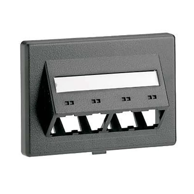 The Mini-Com Modular Furniture sloped Faceplate accepts four Mini-Com Modules. The faceplate mounts to Herman Miller's custom Beltline office furniture opening. The faceplate includes a label pocket for easy identification and is black.