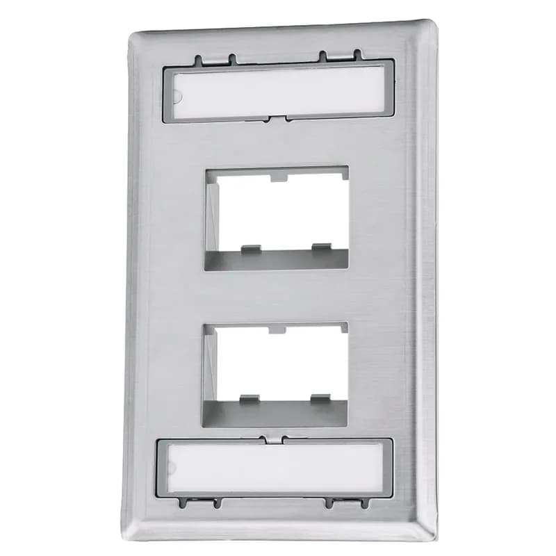 The Mini-Com Stainless Steel Faceplate accepts four Mini-Com Modules. The faceplate is single gang, sloped recessed and mounts to a NEMA standard single gang opening. The faceplate includes a label pocket for easy identification and is made of impact resistant material to support installations in high traffic areas.