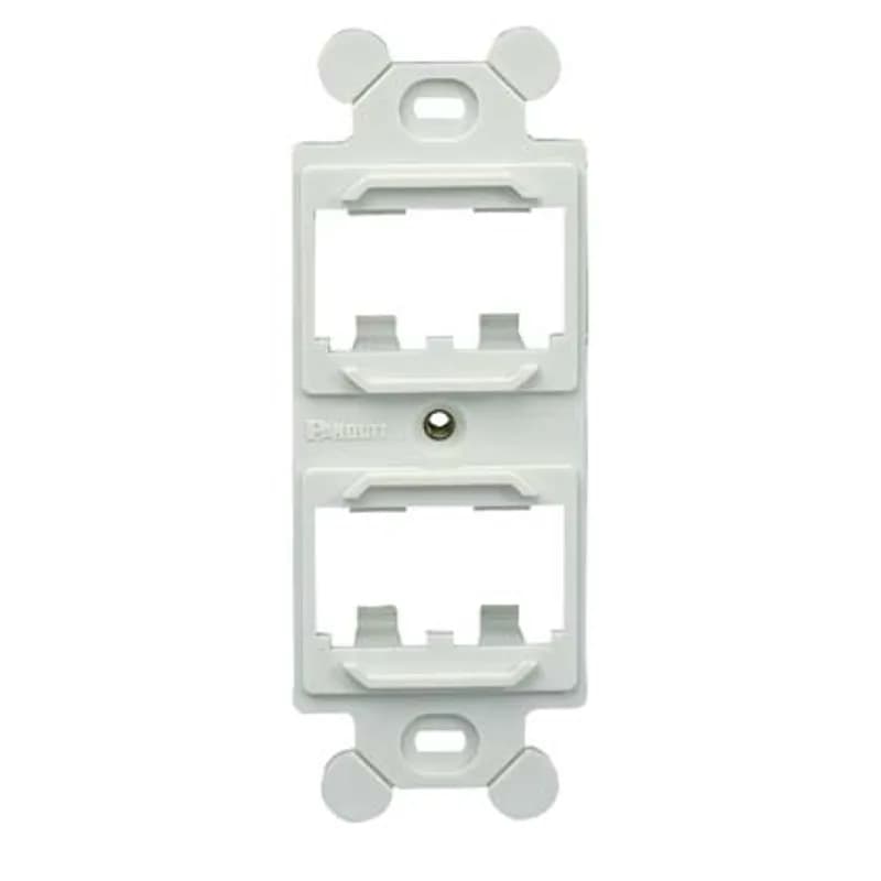 The Mini-Com duplex adapter accepts four Mini-Com modules. The adapter mounts behind a standard 106 NEMA faceplate and is off white.