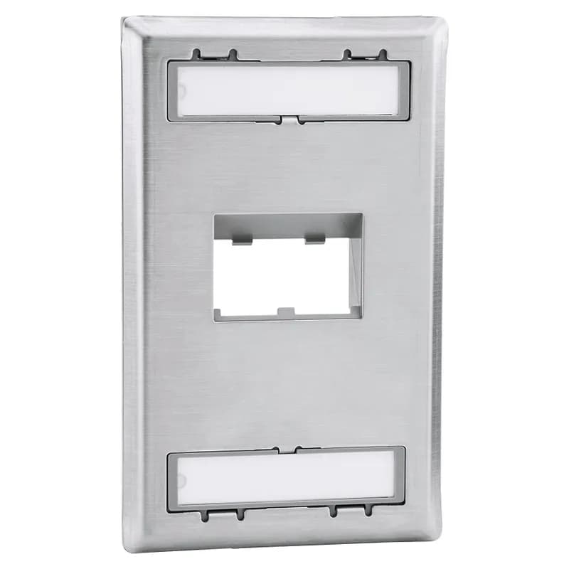 The Mini-Com Stainless Steel Faceplate accepts two Mini-Com Modules. The faceplate is single gang, sloped recessed and mounts to a NEMA standard single gang opening. The faceplate includes a label pocket for easy identification and is made of impact resistant material to support installations in high traffic areas.