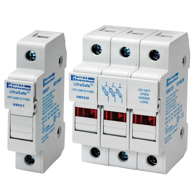 Mersen USCMA - Mersen UltraSafe Fuse Modules (USFM) have a unique, compact design suited for use with 45mm wide IEC contactors. These modules also offer other features not found on other class CC and midget UltraSafe fuseholders such as an auxiliary contact option. When the auxiliary is wired to an adjacent contactor the load is dropped out by the contactor immediately once the fuse extractor handle is opened. Additionally, the fuse module features padlock capabilities, compact bus bars for line side terminations, and tool free removal from DIN rail. Yet the fuse modules still incorporate well known UltraSafe features such as IP20 protection, easy operating fuse extraction handles and an open fuse visual indication option. Adaptor marking strip