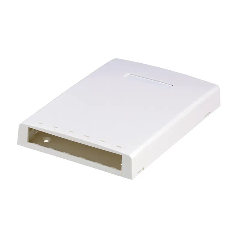 The Mini-Com Multimedia Surface Mount Box accepts six Mini-Com Modules. A built-in fiber spool in the base protects and secures cable slack in place. The box offers a variety of mounting options using adhesive tape or screws. The box includes a label pocket for easy identification and is white.